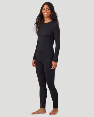 A lady wearing Softwear Long Sleeve Crew in Black side view side view