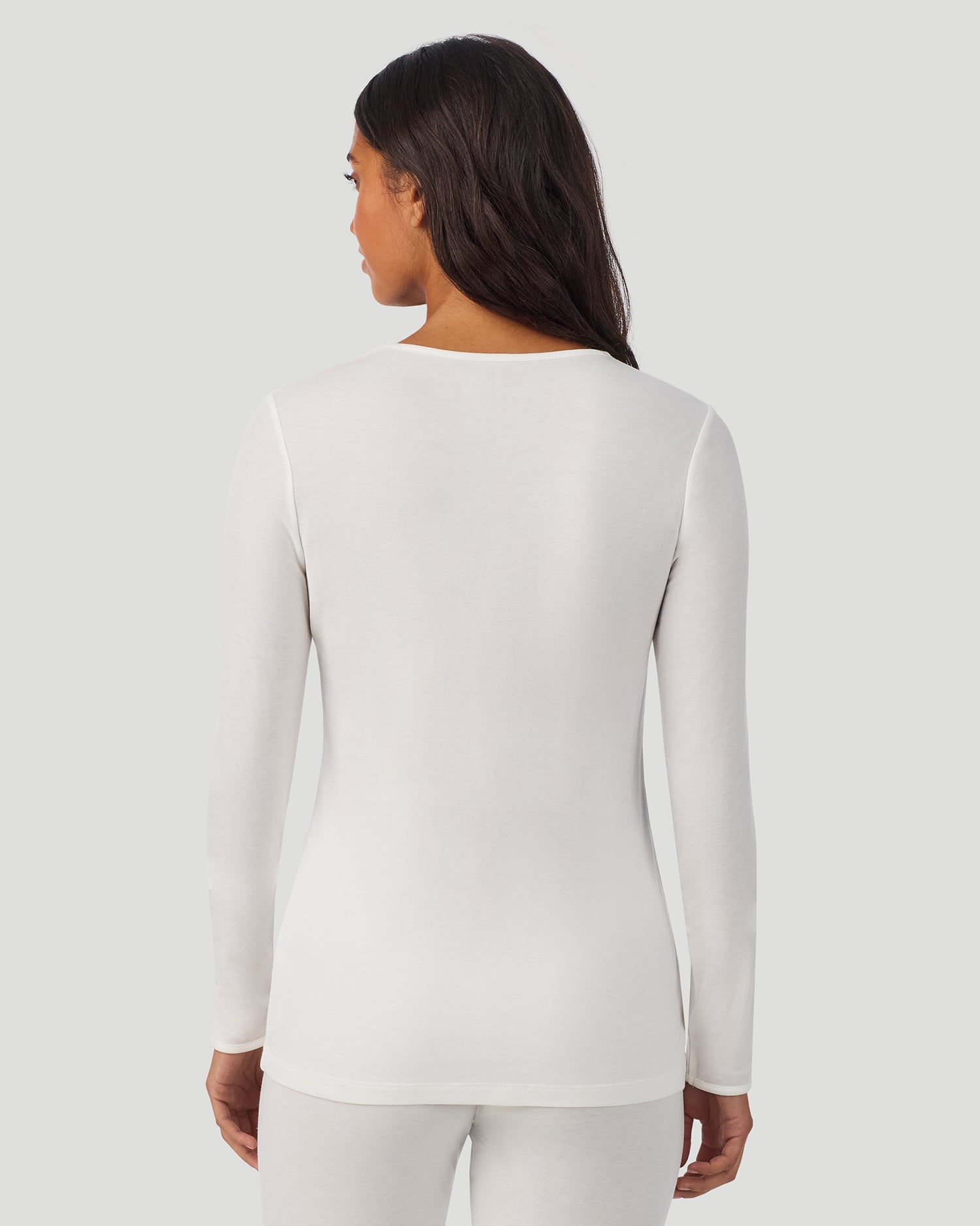 A lady wearing Softwear Long Sleeve Crew in Ivory back view back view
