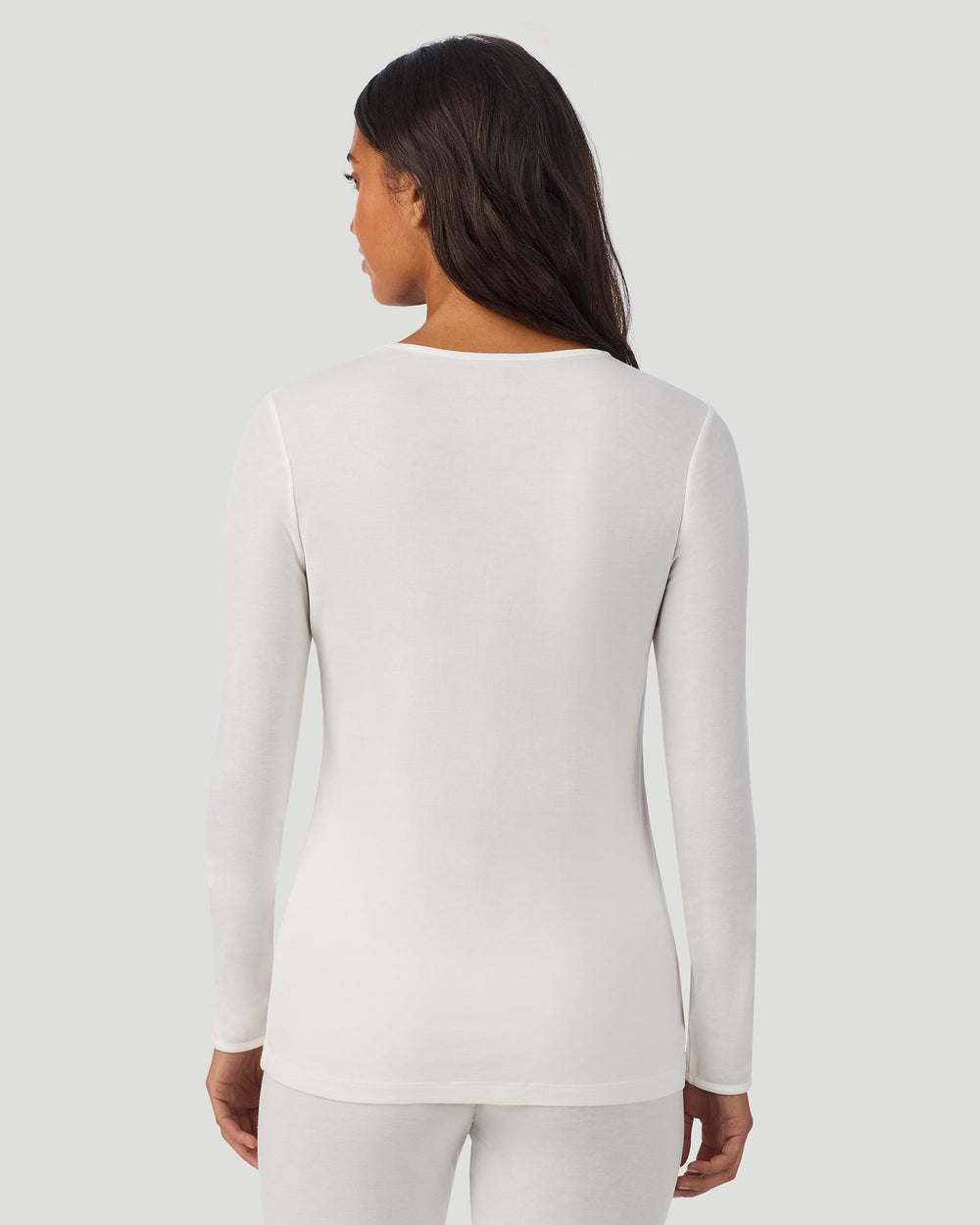 A lady wearing Softwear Long Sleeve Crew in Ivory back view back view