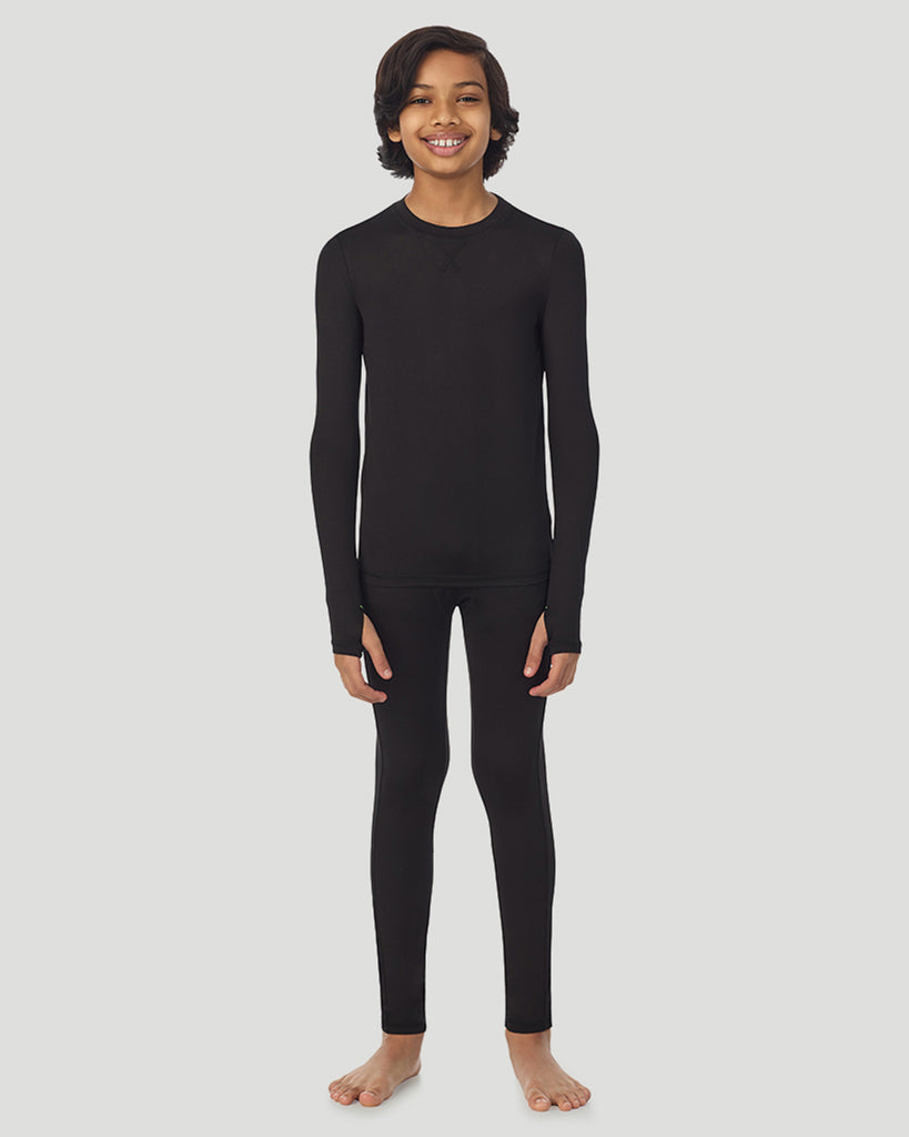 A child wearing black long sleeve t-shirt and pant set 