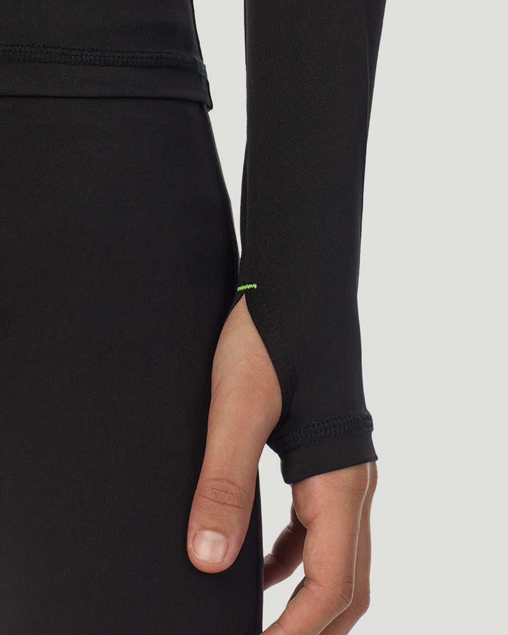 closeup of sleeve of A child wearing black long sleeve t-shirt and pant set