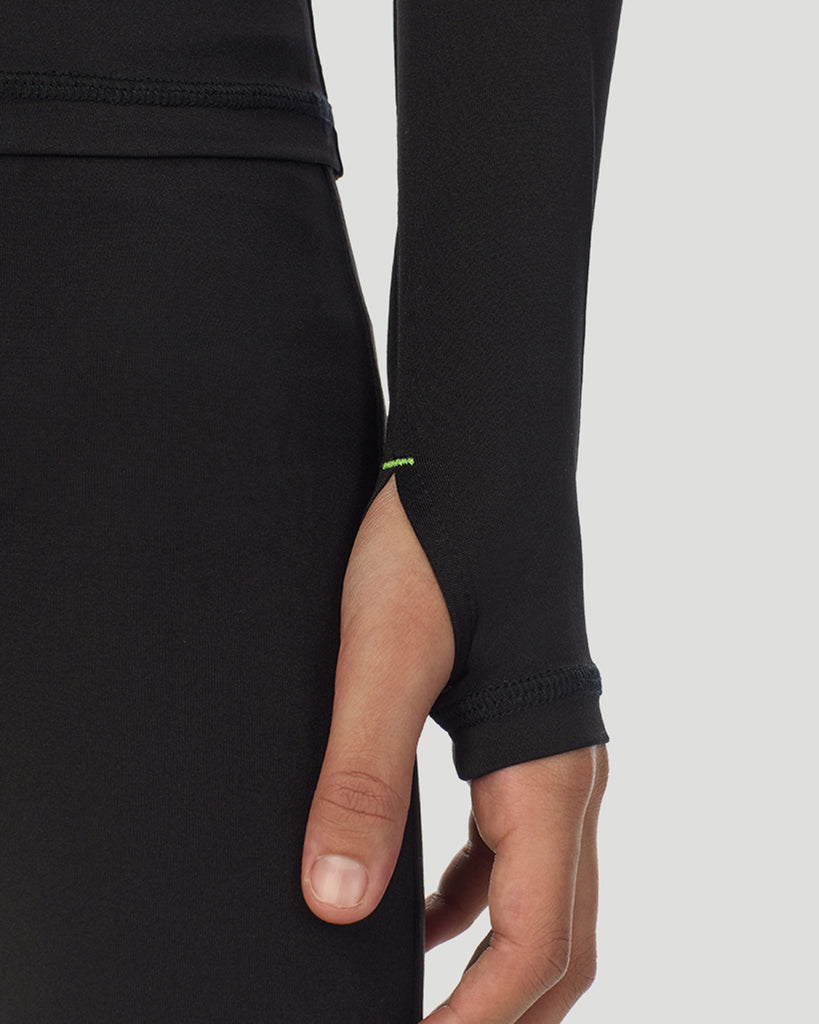 closeup of sleeve of A child wearing black long sleeve t-shirt and pant set 