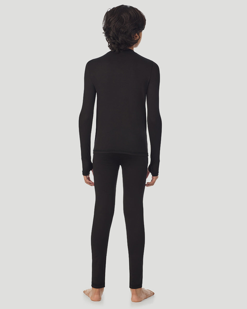 Back view of A child wearing black long sleeve t-shirt and pant set