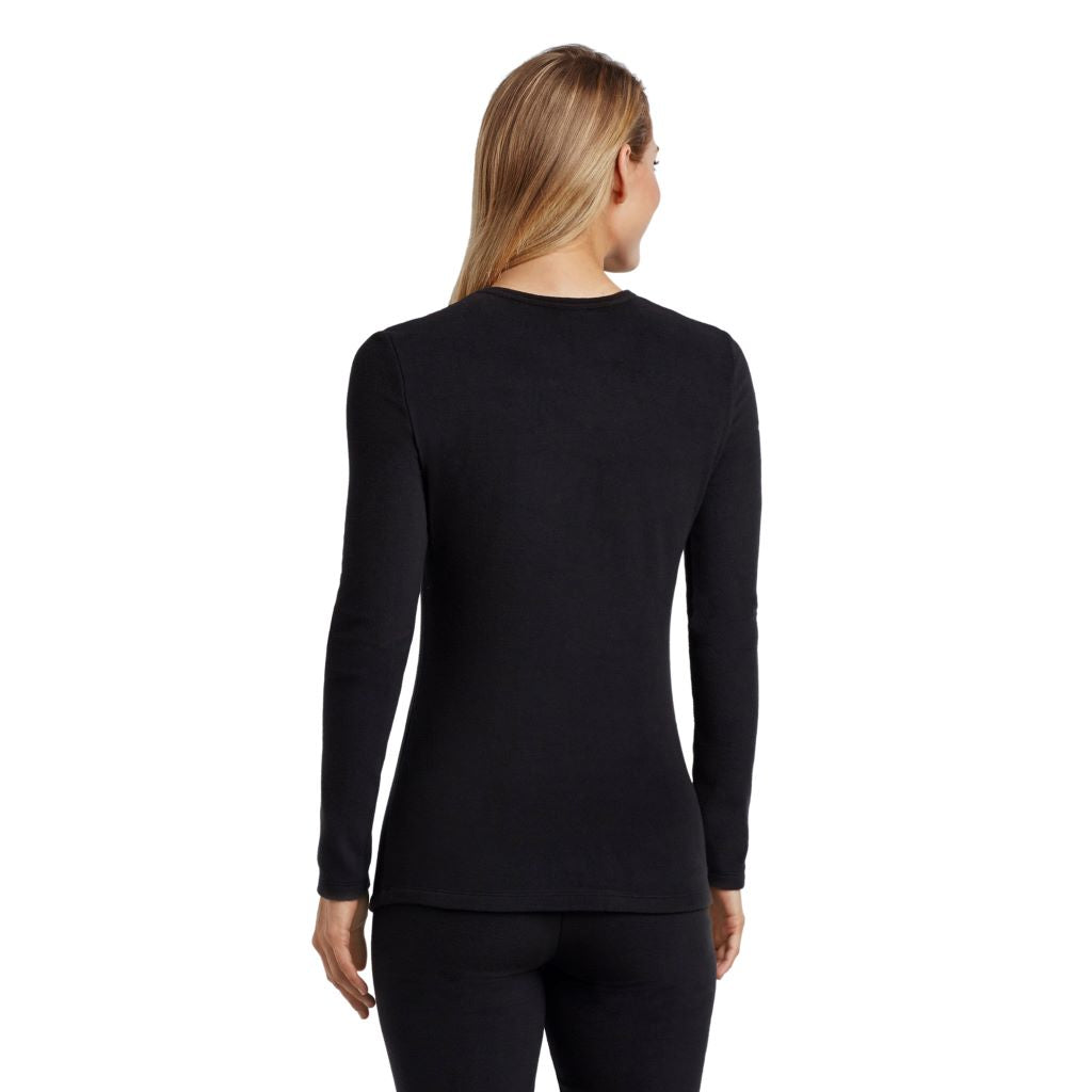 A lady wearing black long sleeve crew