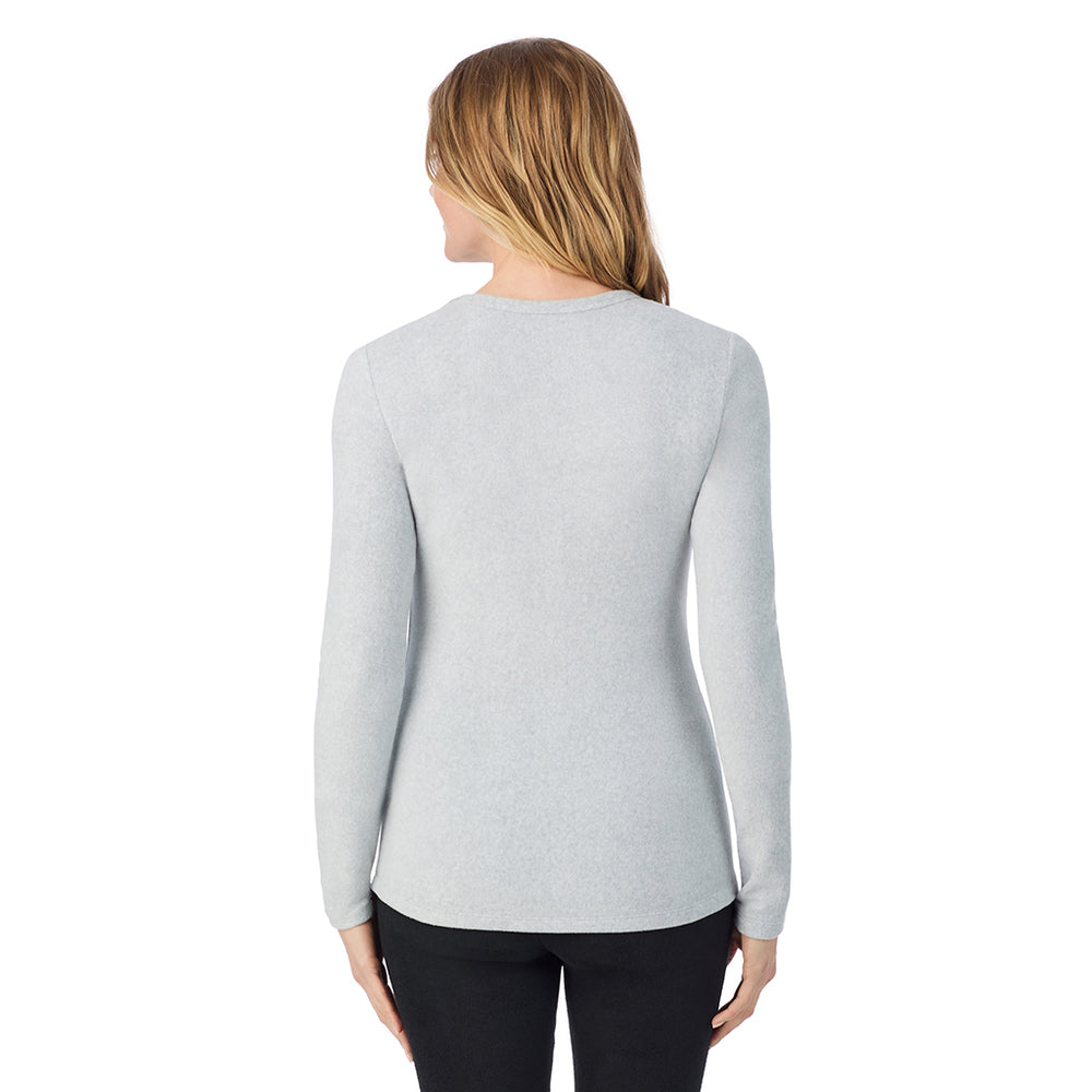 A Lady is wearing a Lt Grey Heather Fleecewear With Stretch Long Sleeve Crew TALL !94% Recycled Polyester, 6% Spandex!