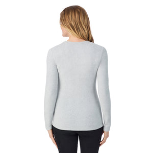 A lady wearing light grey heather long sleeve crew
