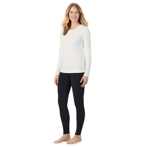A lady wearing off white long sleeve crew