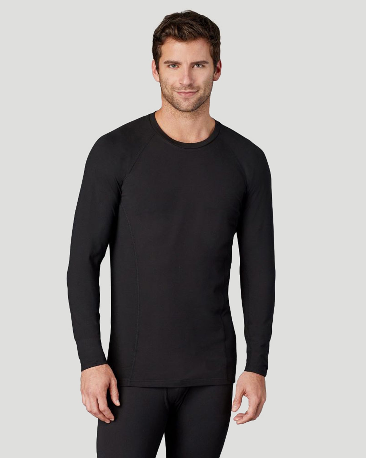 Black; Model is wearing size M. He is 6'1", Waist 31", Inseam 33".@A man wearing black long sleeve crew t-shirt !88% Polyester, 12% Spandex!