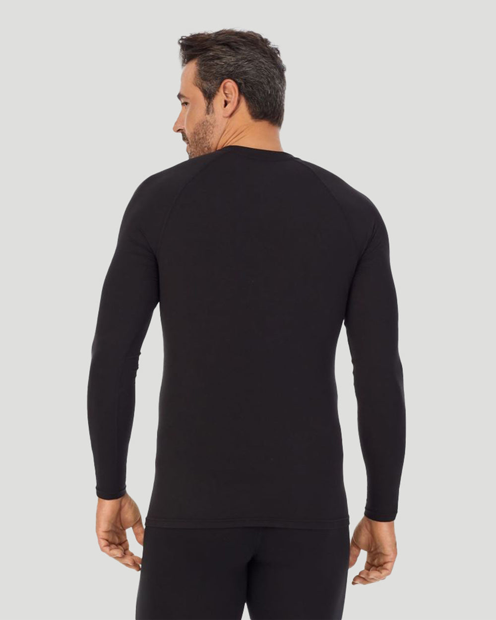 A man wearing black long sleeve crew t-shirt !88% Polyester, 12% Spandex!