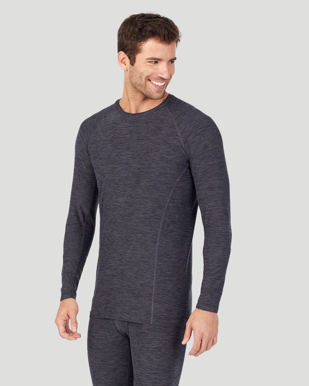A man wearing grey long sleeve crew t-shirt !88% Polyester, 12% Spandex!