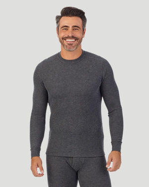 A man wearing a charcoal heather waffle thermal long sleeve crew.