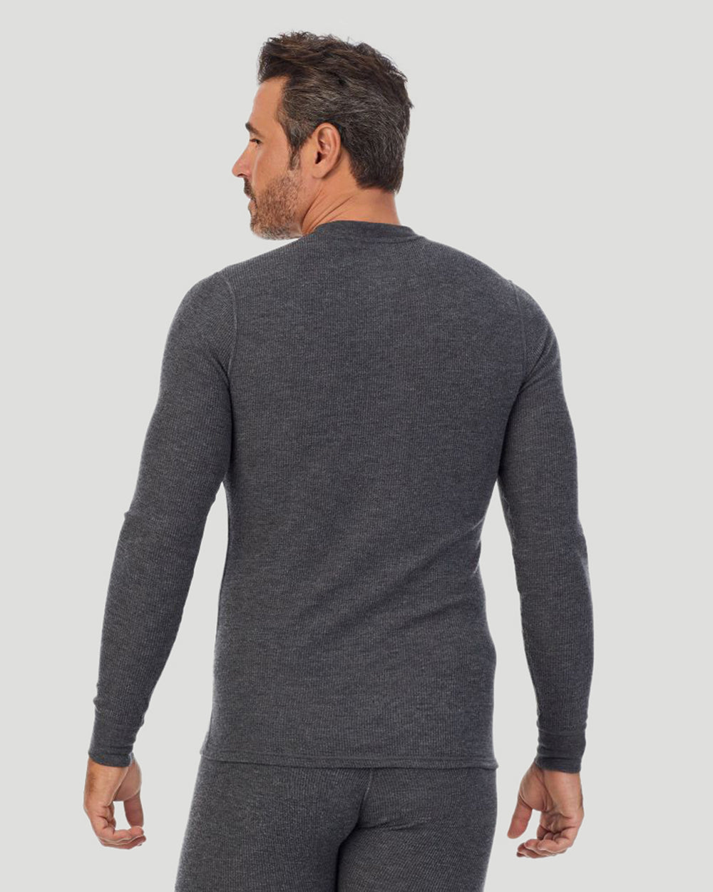 A man wearing a charcoal heather waffle thermal long sleeve crew back view