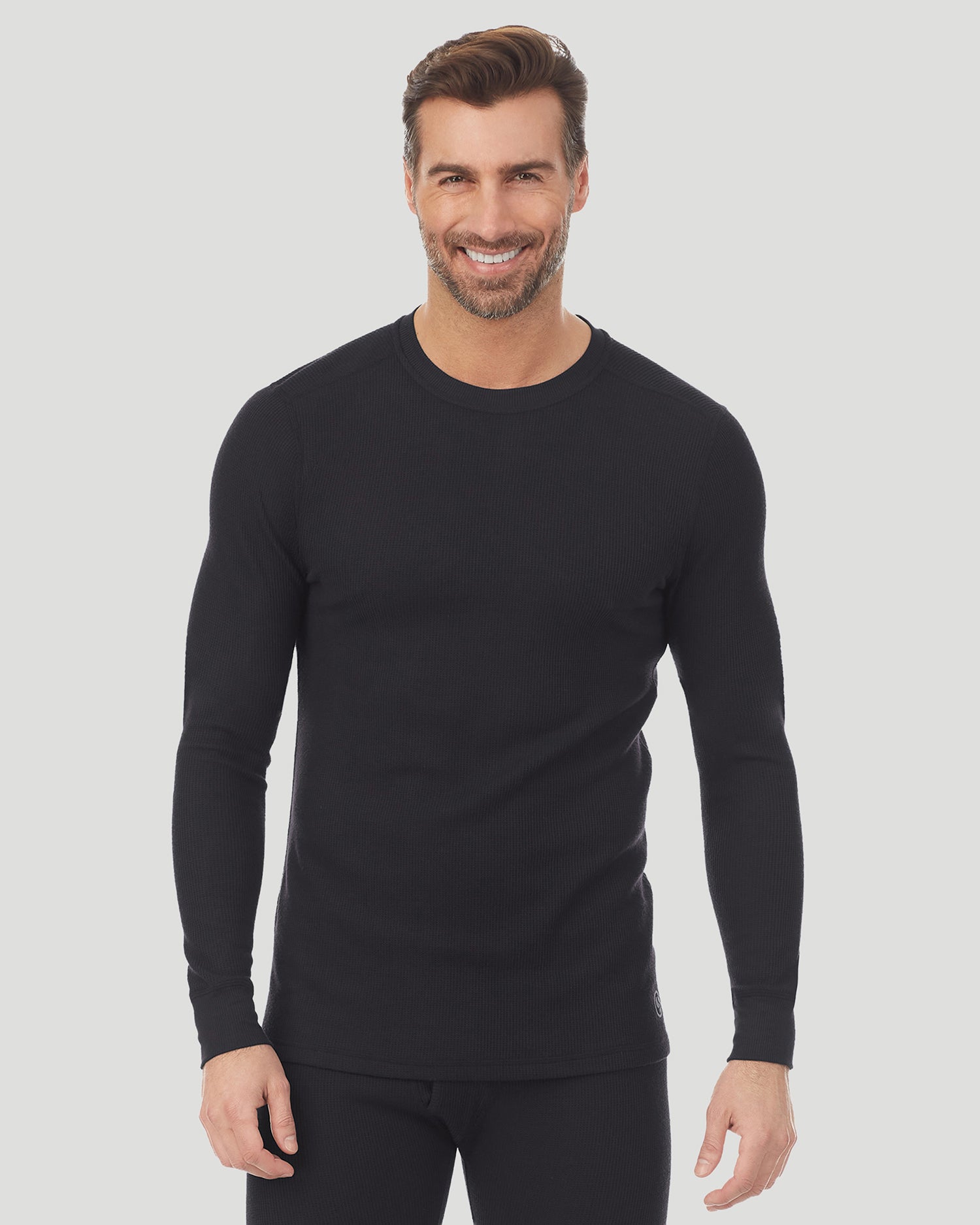 Black; Model is wearing size M. He is 6'1", Waist 32", Inseam 32". @A man wearing a black waffle thermal long sleeve crew.