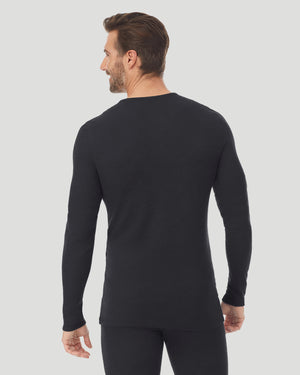 A man wearing a black waffle thermal long sleeve crew back view