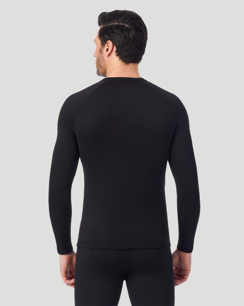 A man wearing a black X fleece long sleeve crew back pose
