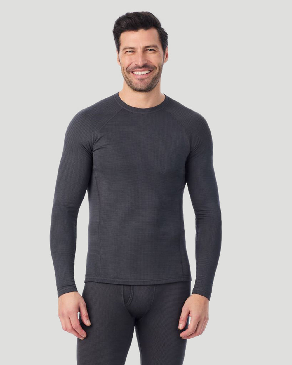 A man wearing a asphalt X fleece long sleeve crew front pose