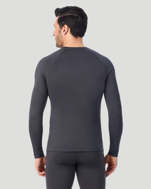 A man wearing a asphalt X fleece long sleeve crew back pose