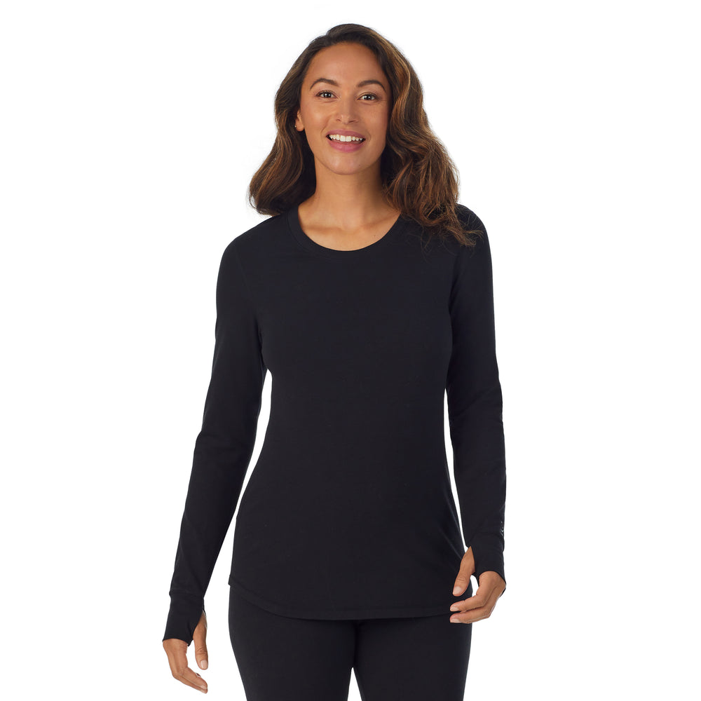 A lady wearing black cottonwear long sleeve scoop neck