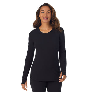 A lady wearing black cottonwear long sleeve scoop neck