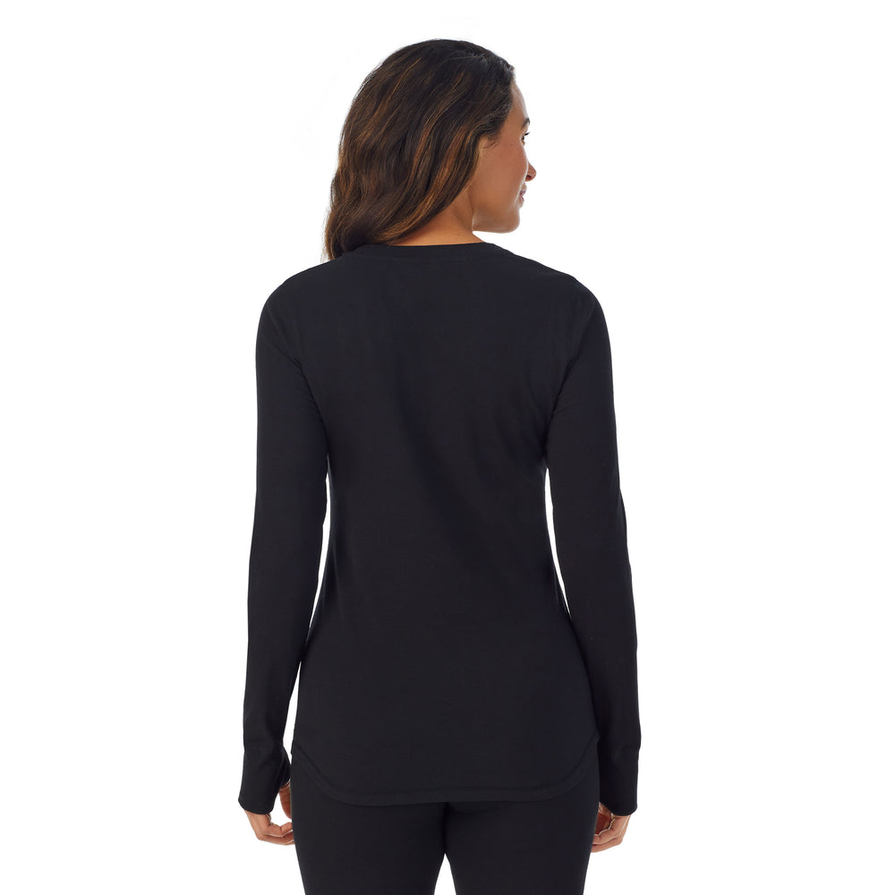 A lady wearing black cottonwear long sleeve scoop neck