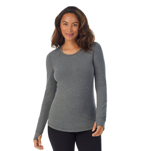 A lady wearing dark charcoal heather cottonwear long sleeve scoop neck