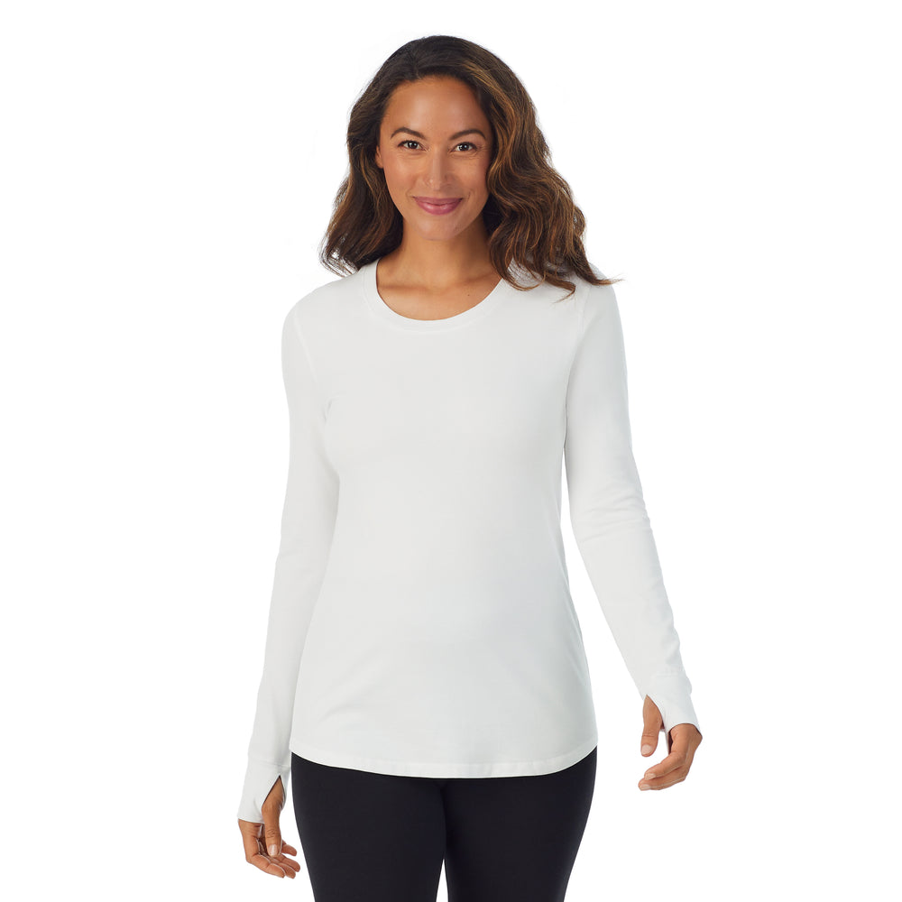 A lady wearing white cottonwear long sleeve scoop neck