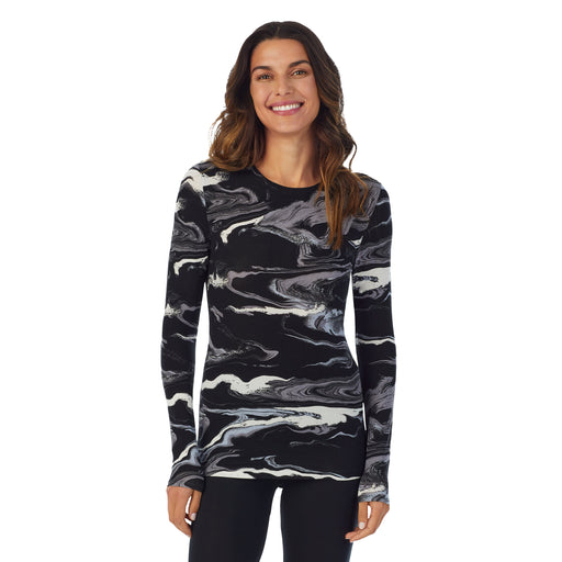 Black & White Marble; Model is wearing size S. She is 5’9”, Bust 34”, Waist 25.5”, Hips 36.5”. @A lady wearing a Black & White Marble long sleeve stretch crew.