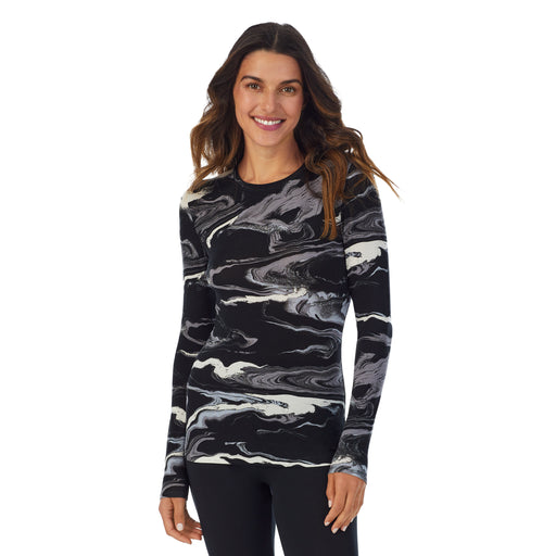 Black & White Marble; Model is wearing size S. She is 5’9”, Bust 34”, Waist 25.5”, Hips 36.5”. @A lady wearing a Black & White Marble long sleeve stretch crew.