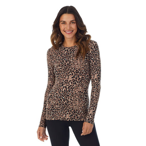 Pecan Leopard; Model is wearing size S. She is 5’9”, Bust 34”, Waist 25.5”, Hips 36.5”. @A lady wearing a Pecan Leopard long sleeve stretch crew.
