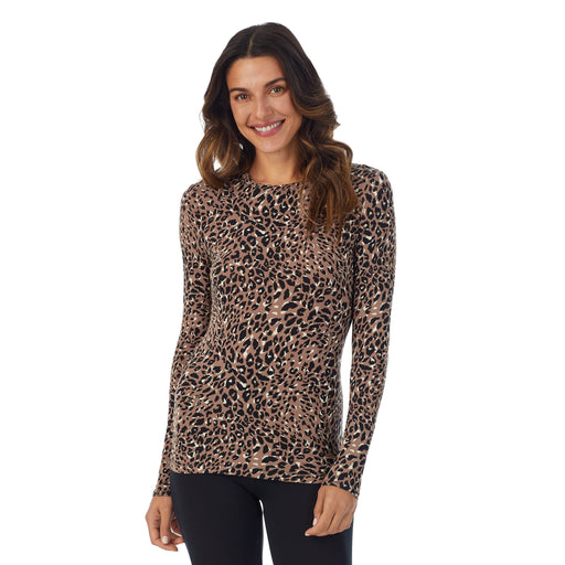 Pecan Leopard; Model is wearing size S. She is 5’9”, Bust 34”, Waist 25.5”, Hips 36.5”. @A lady wearing a Pecan Leopard long sleeve stretch crew.
