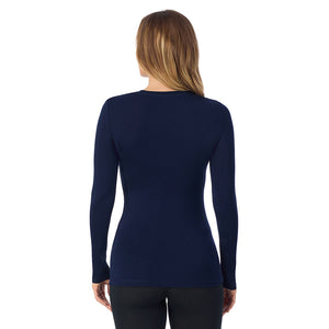 A lady wearing a Navy Blazer long sleeve stretch crew.
