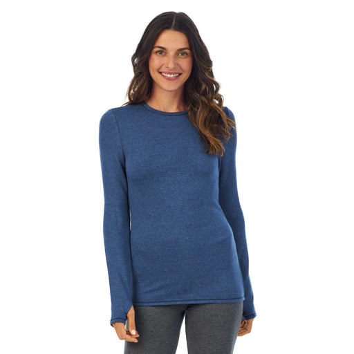 Ultramarine Heather; Model is wearing size S. She is 5’9”, Bust 34”, Waist 25.5”, Hips 36.5”. @A lady wearing a Ultramarine Heather long sleeve crew.