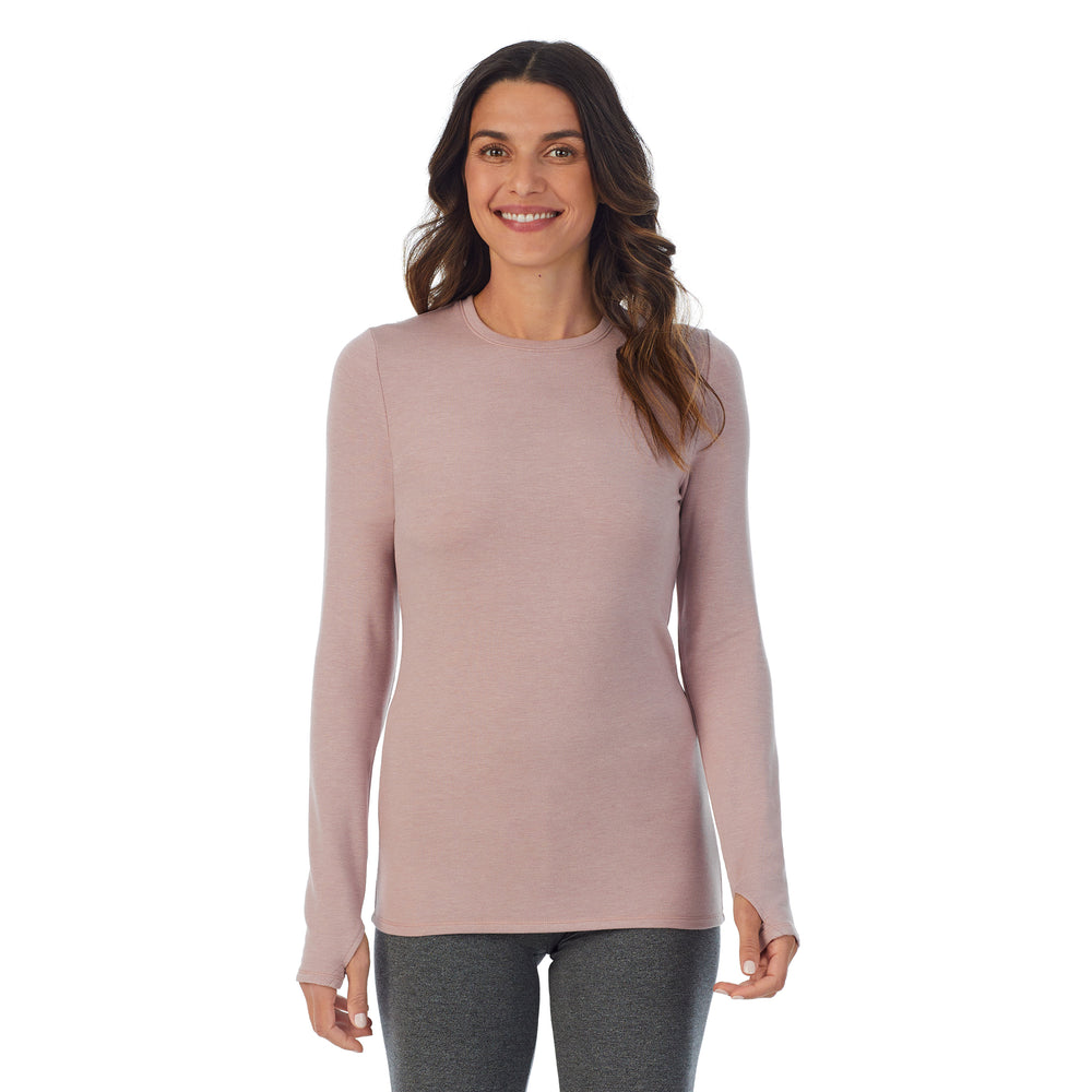 A lady wearing a Mauve Shadow Heather long sleeve crew.