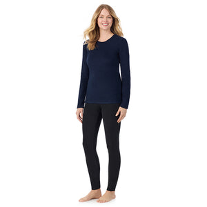  A Lady is wearing a Navy Blazer Fleecewear With Stretch Long Sleeve Crew PETITE