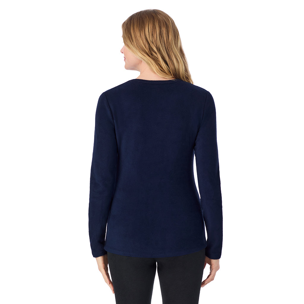 A lady wearing navy blazer long sleeve crew