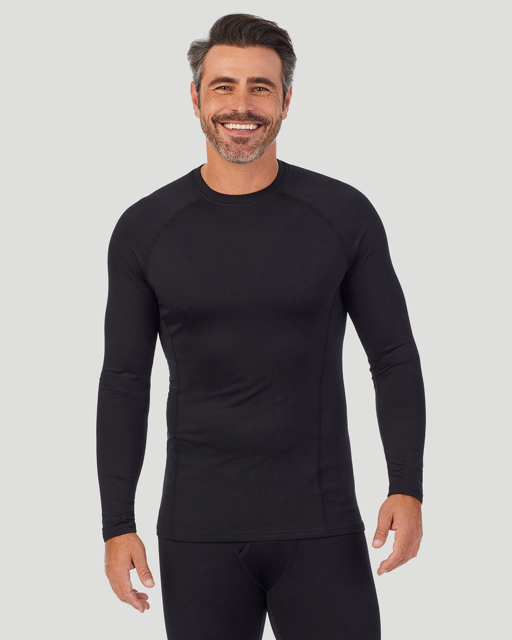 A man wearing black long sleeve crew front pose.  !88% Polyester, 12% Spandex!