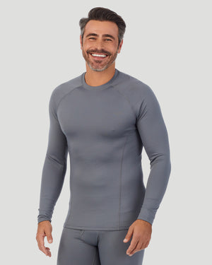 A man wearing nickel grey arcticore long sleeve crew. !88% Polyester, 12% Spandex!