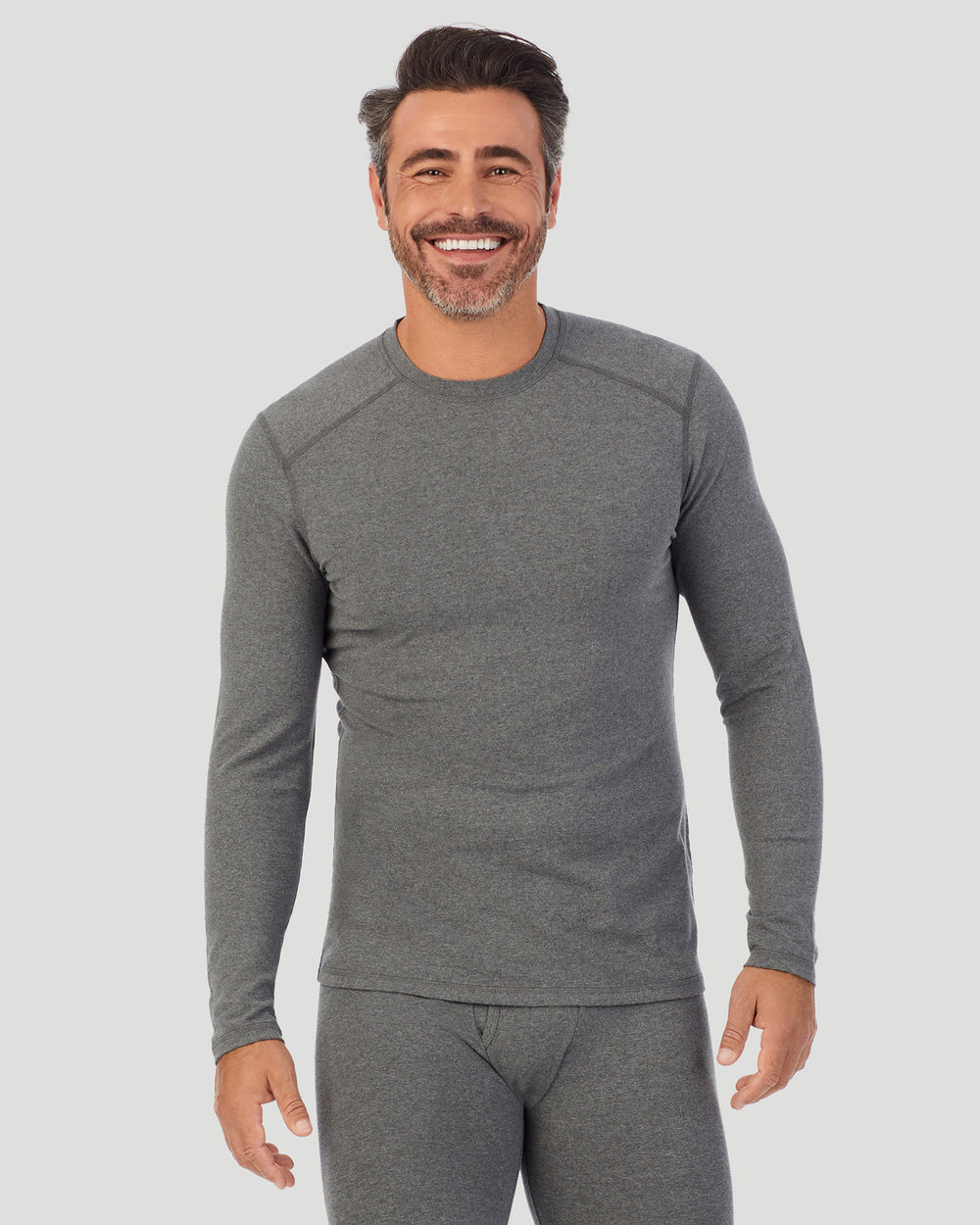 A man wearing a Grey Heather long sleeve crew
