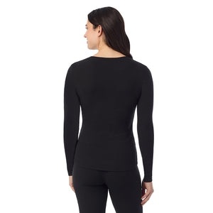  A Lady is wearing a Black Stretch Rib Long Sleeve Crew