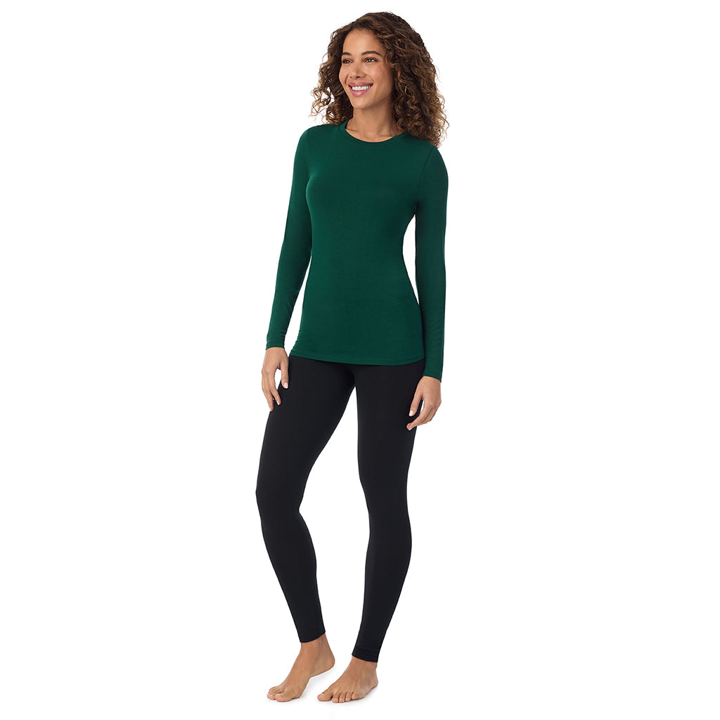 A lady wearing evergreen  longsleeve crew.