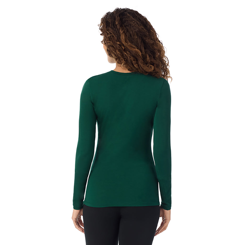 A lady wearing evergreen   longsleeve crew.