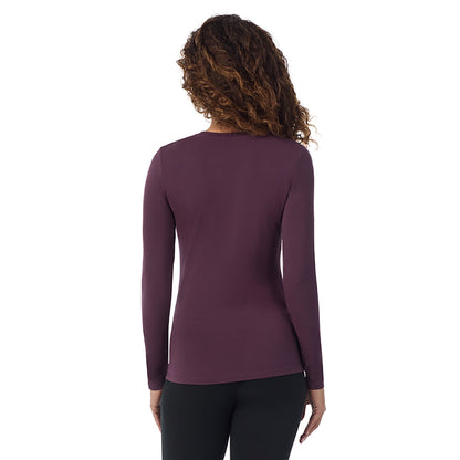 Boysenberry; Model is wearing size S. She is 5’9”, Bust 34”, Waist 23”, Hips 35”. @A lady wearing boysenberry  longsleeve crew.