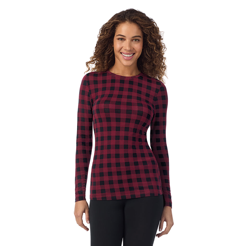 A lady wearing cabernet buffalo check  longsleeve crew.