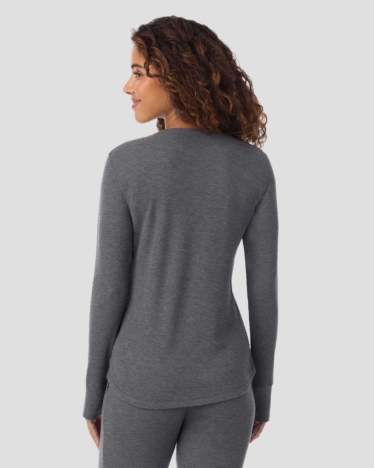 A lady wearing Cozy Stretch Thermal Long Sleeve Crew in Stone Grey Heather side view side view