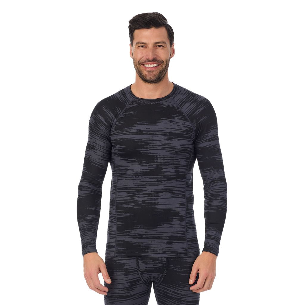 Black Allover Print; Model is wearing a size M. He is 6’2”, Waist is 32”, Inseam 34”.@A man wearing black allover print long sleeve crew t-shirt !88% Recycled Polyester, 12% Spandex!