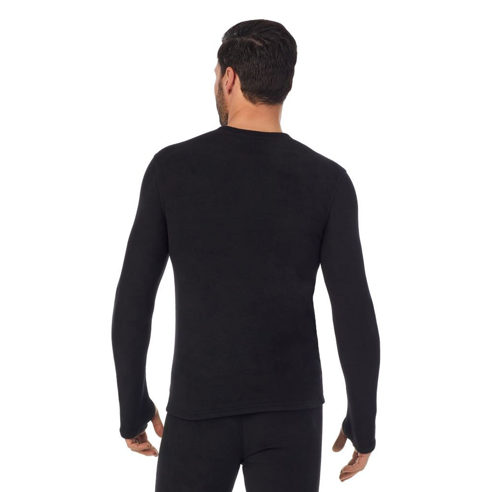 A man wearing black long sleeve fleecewear crew.