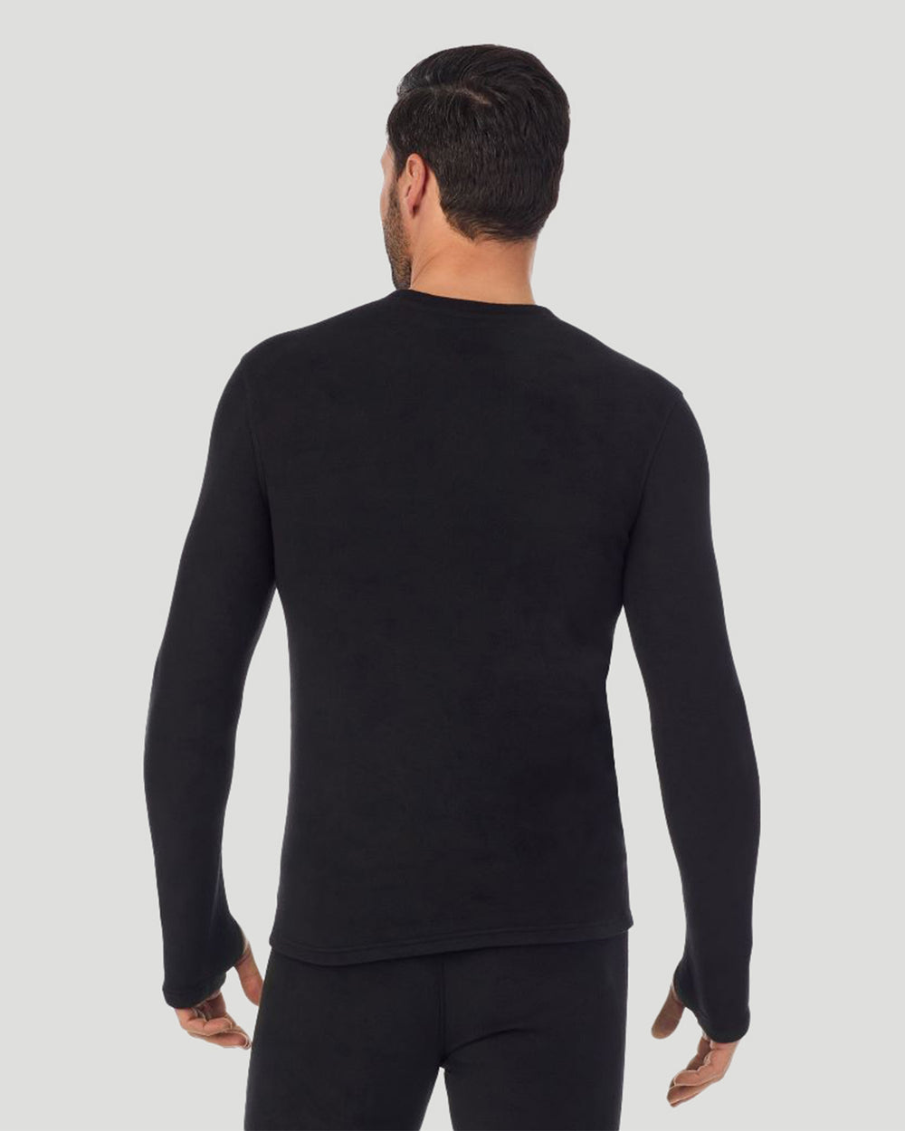 A man wearing black long sleeve fleecewear crew.