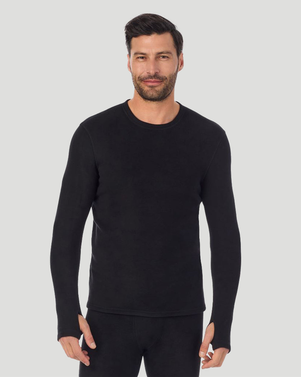 A man wearing black long sleeve fleecewear crew.
