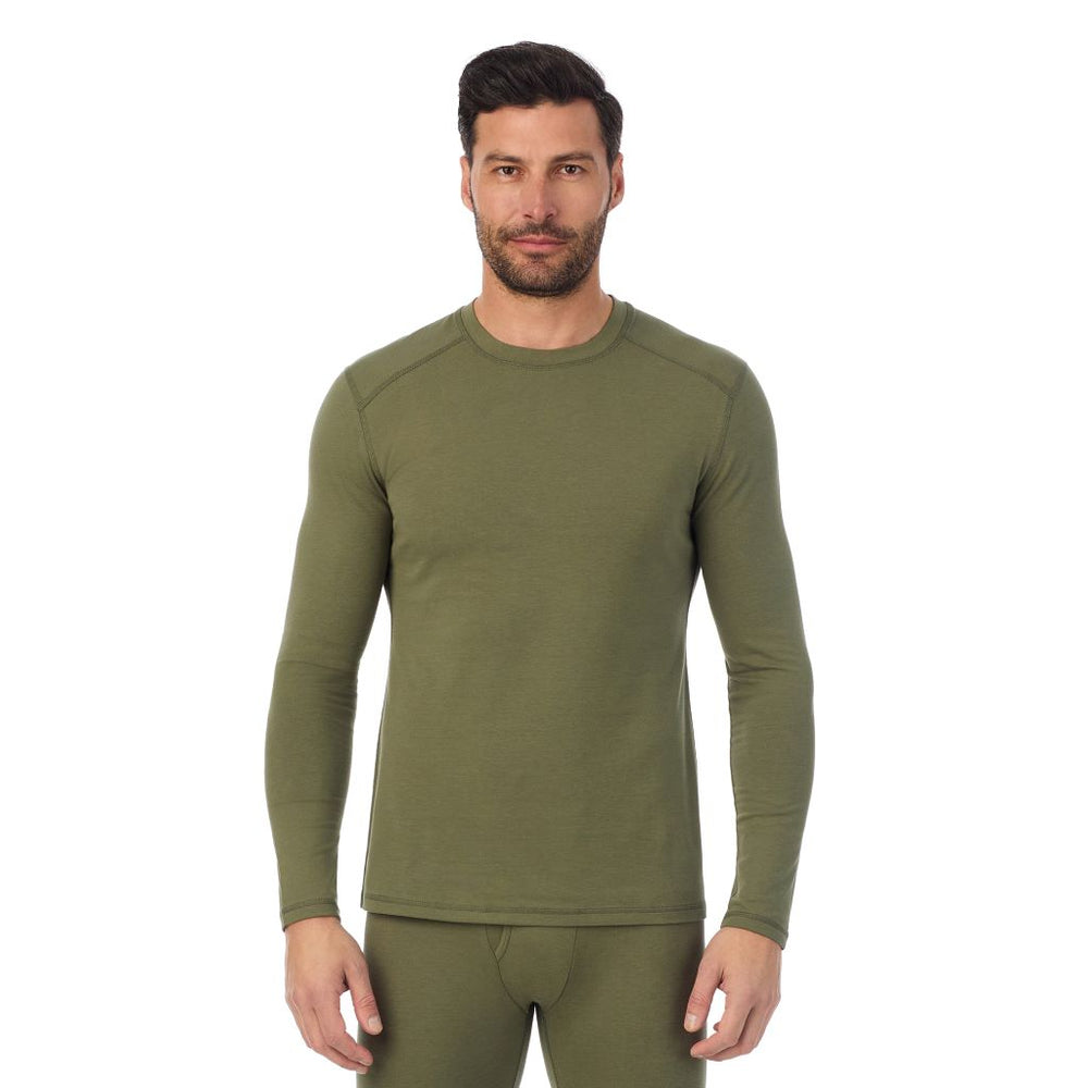 A man wearing a army green long sleeve crew