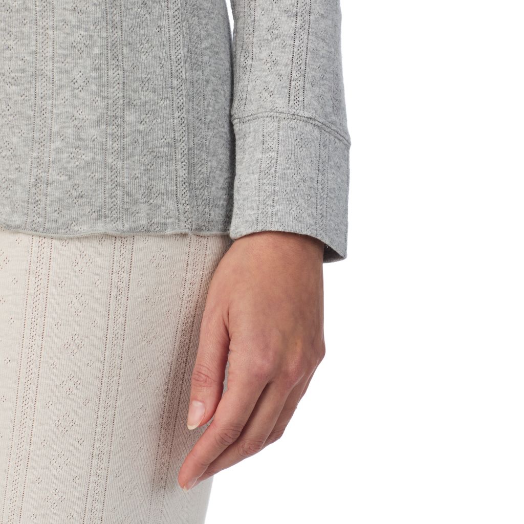 A lady is wearing Cotton Pointelle Long Sleeve Crew
